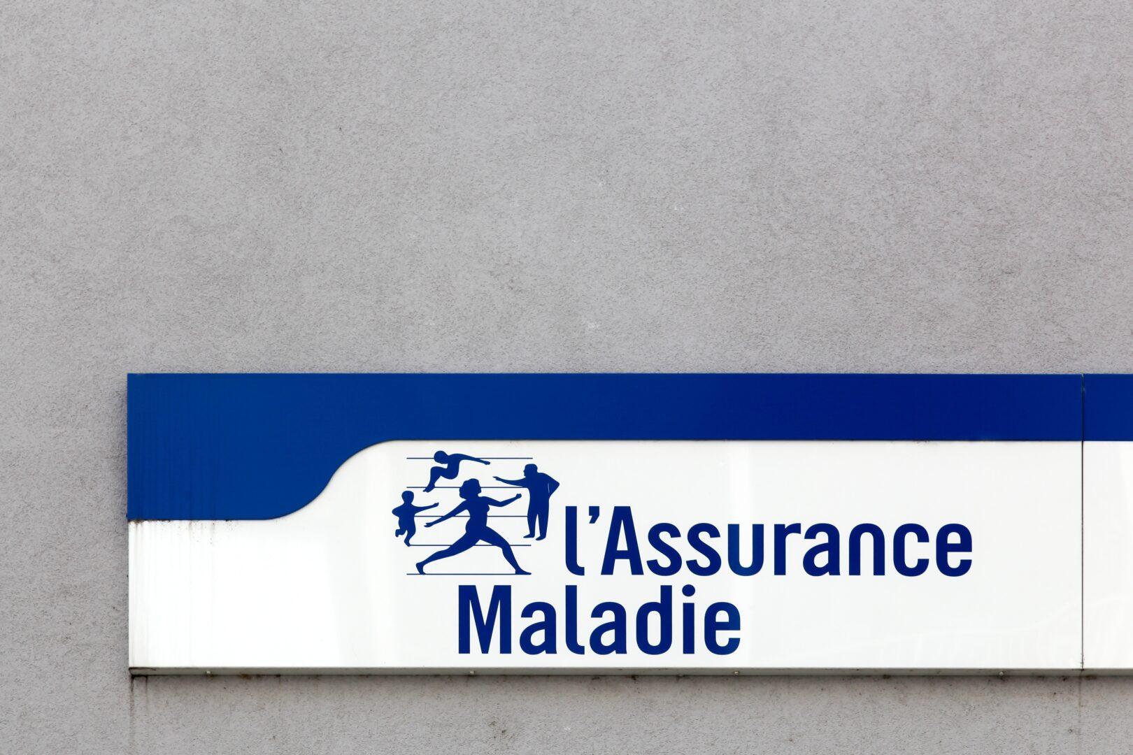 Firminy, France - August 17, 2016: French social security and Illness branch called Assurance Maladie sign on a wall