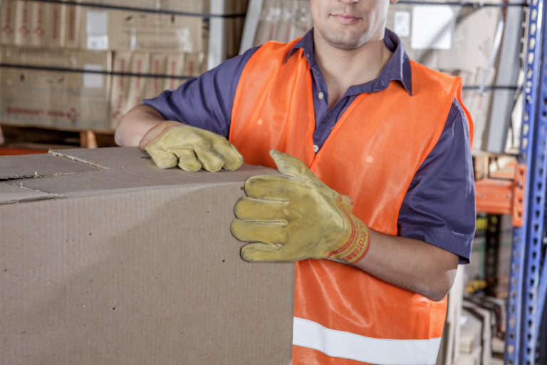 Workers In Warehouse Preparing Goods For shipping Workers In Warehouse Preparing Goods For shipping